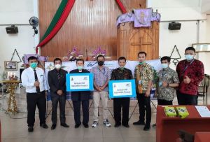 Natal di Tengah Pandemi Covid-19, WOM Finance Bagikan Kasih Natal Serentak di 14 Kota